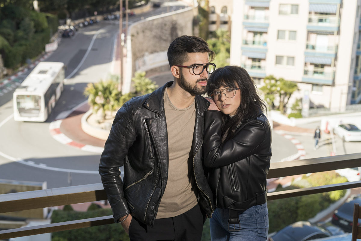 Couple wearing F1 Optical frames above the Monaco hairpin