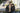 Couple wearing F1 Optical frames above the Monaco hairpin