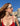 Woman in red dress wearing white pearl Monaco by Eye Respect sunglasses at the port of Monaco